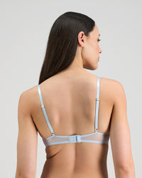 Model wears Jeanie Push Up Bra in OMPHALODES. On body back view