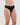 Model wears Cotton And Lace Thong in BLACK. On body side view