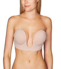Model wears Deep Plunge Bra Strap + Back Less Bra in Nude. On body front view