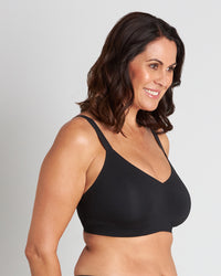Model wears Comfit Collection Wire Free Bra in BLACK. On body side view