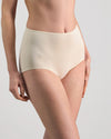 Model wears Freestyle Full Brief in CHAMPAGNE. On body side view