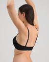 Model wears My Fit Smooth Strapless Bra in BLACK. On body side view