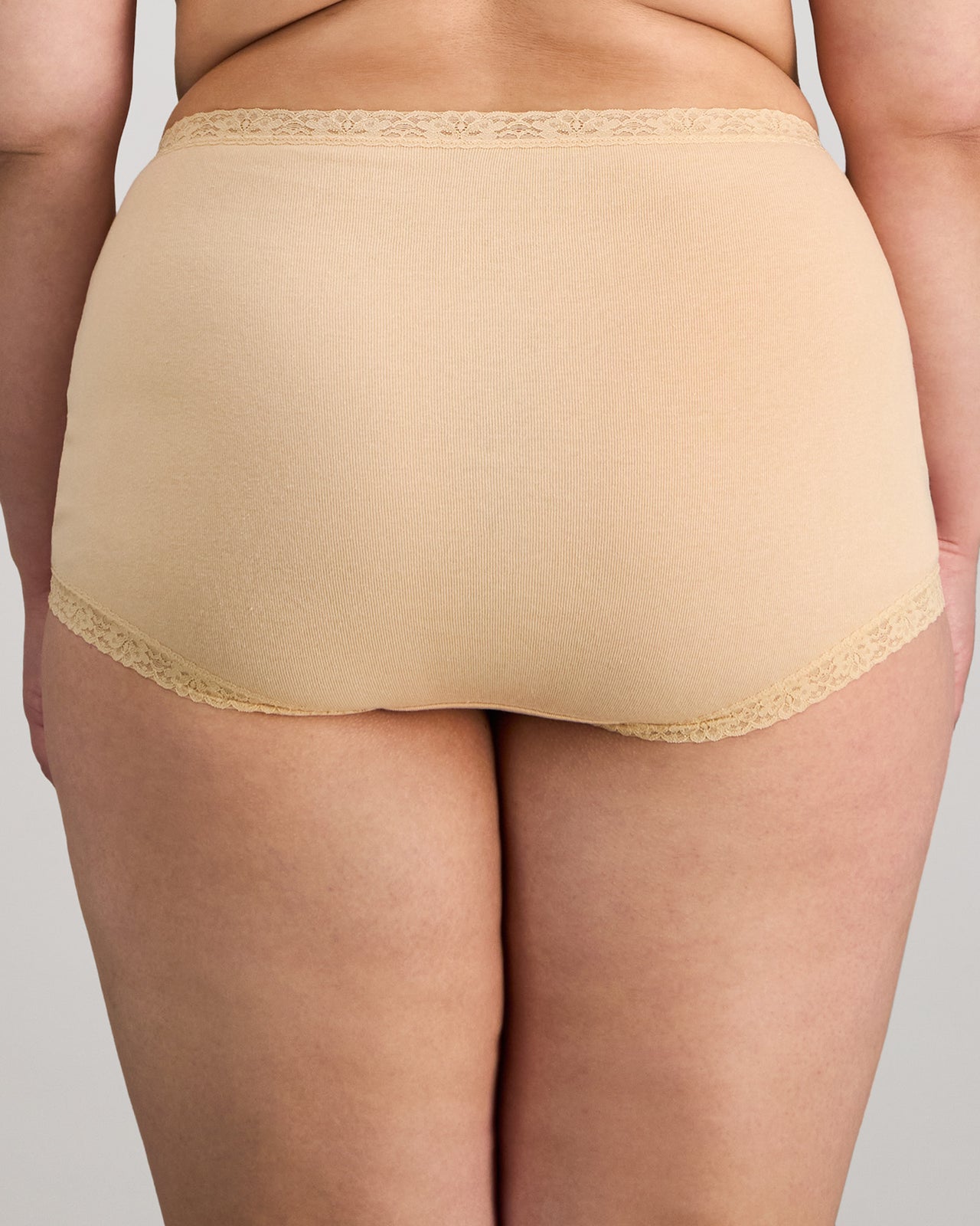 Model wears Bendon Cotton Full Brief in NATURELLE. On body back view