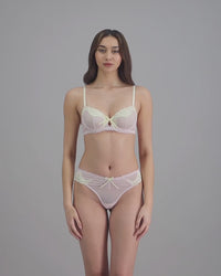 model-poses-in-pale-pink-lingerie-set