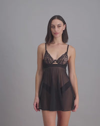 model-poses-in-black-chemise