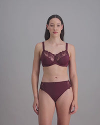 model-poses-in-coral-bra-and-underwear-set