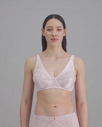 model-poses-in-light-pink-lingerie-set