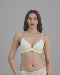 model-poses-in-light-yellow-lingerie-set