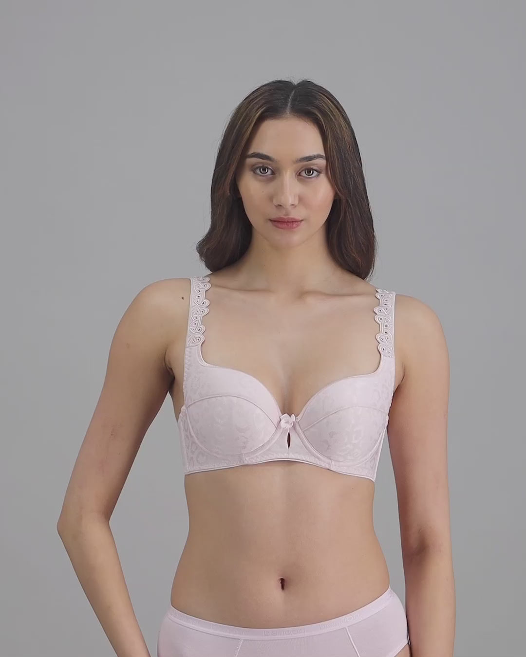 model-poses-in-pale-pink-lingerie-set