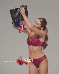 model-poses-in-red-bra